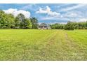 Quaint home with a spacious yard and surrounded by lush greenery at 6650 Highway 341 Hwy, Kershaw, SC 29067