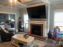 Inviting living room featuring a fireplace, mantle with TV, and neutral color palette at 6650 Highway 341 Hwy, Kershaw, SC 29067