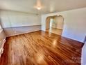 Bright living room featuring hardwood floors and an open floor plan to other rooms at 820 Kerley Ct, Statesville, NC 28677