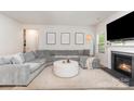 Comfortable living room with a fireplace and a large sectional sofa at 941 Rachel Anne Dr, Belmont, NC 28012