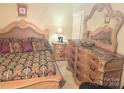 This bedroom features a large dresser with a marble top and matching mirror at 1253 Iverleigh Trl, Charlotte, NC 28270