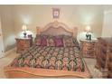 A well-decorated bedroom features matching marble-topped nightstands and a large, upholstered bed at 1253 Iverleigh Trl, Charlotte, NC 28270