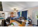 Inviting living room with hardwood floors, large window, and comfortable furnishings at 1315 Cortland E Rd, Charlotte, NC 28209