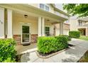 Inviting covered front porch with classic columns and a welcoming entrance at 1412 Afternoon Sun Rd, Matthews, NC 28104