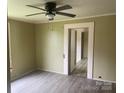 A spacious living room featuring light gray walls and updated floors at 1418 Old Wilkesboro Rd, Salisbury, NC 28144