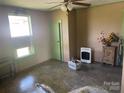 Bright living room showcasing an ornate ceiling fan and adjacent doorway at 1418 Old Wilkesboro Rd, Salisbury, NC 28144