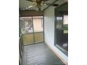 Cozy screened-in porch with ceiling fan, offering a relaxing outdoor space at 1418 Old Wilkesboro Rd, Salisbury, NC 28144
