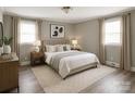 Tastefully furnished bedroom with a comfortable bed, soft lighting, and an area rug at 1421 Thompson Ave, Charlotte, NC 28216