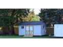 Backyard storage shed with ramp and double doors at 1421 Thompson Ave, Charlotte, NC 28216