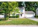 Charming two-story home with a two car garage, solar panels, and a well-manicured front lawn at 1518 Glenbar Ct, Clover, SC 29710