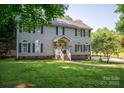 Charming two-story home with gray siding, black shutters, and a welcoming front porch at 1575 Lewis Farm Rd, Kings Mountain, NC 28086
