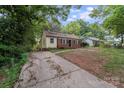 Charming home featuring a combination of brick and vinyl siding at 2214 Grimes St, Charlotte, NC 28206