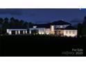 Stunning nighttime architectural rendering of a modern home with a three-car garage at 268 Hermance Ln, Mooresville, NC 28117