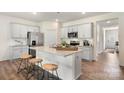 Modern kitchen featuring gray cabinets, stainless appliances, and a center island at 3019 Sassafrass Trl, Gastonia, NC 28056