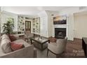 Cozy living room with built-in bookshelves, fireplace, and ample seating at 402 W 8Th St, Charlotte, NC 28202