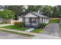 Charming bungalow with black and white trim, inviting porch, and manicured landscaping at 418 Link St, Fort Mill, SC 29715