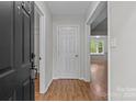 Inviting entryway with neutral walls, hardwood floors, and clear sightlines to adjoining rooms at 4232 Saint Audrey Pl, Charlotte, NC 28269