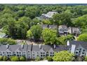 Aerial view showcasing a community surrounded by lush trees and greenery at 430 Queens Rd # 332, Charlotte, NC 28207