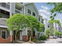 Charming condo building with manicured trees and landscaping at 430 Queens Rd # 332, Charlotte, NC 28207