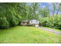 Split level home surrounded by lush greenery and mature trees, offering privacy and shade at 610 N Shaver St # 14, Salisbury, NC 28144