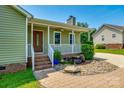 Inviting front porch with stone accents and brick steps leading to a decorative front door at 752 Chipmeadow Ln, York, SC 29745