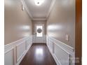 Inviting entryway boasting hardwood floors and decorative wainscoting for added charm at 120 Autumn Mist Rd, Statesville, NC 28677