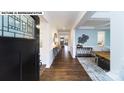 Bright foyer with hardwood floors, stylish decor, and a view into the dining area at 144 Asmodean Ln, Troutman, NC 28166