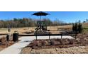 Community playground with slides and benches, perfect for Gathering fun and outdoor activities at 144 Parker Claire Ln, Kings Mountain, NC 28086