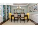 Formal dining room showcasing a stylish table setting, decorative curtains, and elegant display cabinets at 146 Asmodean Ln, Troutman, NC 28166