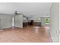Spacious living area featuring wood-look floors, neutral walls, and ceiling fan at 151 Lillyfield Dr, Rockwell, NC 28138