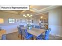 Elegant dining room featuring a coffered ceiling and stylish furnishings at 160 Asmodean Ln, Troutman, NC 28166