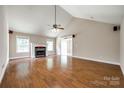 Bright living room featuring a fireplace, vaulted ceilings, and hardwood flooring at 2027 Ellison Dr, Rock Hill, SC 29730