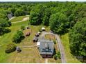 Expansive property showcasing the home, multiple outbuildings, and surrounding greenery at 2809 N Main St, Kannapolis, NC 28081