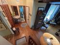 Welcoming foyer featuring hardwood floors, a staircase, decor, and a glimpse into the nearby bathroom at 2815 Penny Park Dr, Gastonia, NC 28052