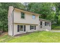 Charming home with a freshly painted brick and siding exterior, complemented by black shutters and well-maintained landscaping at 3121 Revolution Park Dr, Charlotte, NC 28217