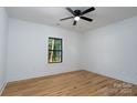 Bright bedroom featuring sleek ceiling fan, wood-look flooring, and ample natural light at 315 W Hoke W St, Landis, NC 28088