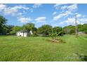Wide shot of a spacious backyard, highlighting the large lot and potential for outdoor activities and landscaping at 319 Glenhaven Dr, Charlotte, NC 28214