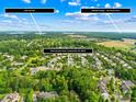 Stunning aerial view of neighborhood near Lake Norman, showcasing lush greenery and proximity to Birkdale Village at 3918 Halcyon Dr, Huntersville, NC 28078