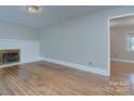 Spacious living room with refinished hardwood floors and neutral paint at 3951 Whitehall Dr, Charlotte, NC 28208