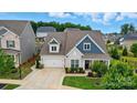 An aerial shot showcasing the well-maintained home, its manicured lawn, and the surrounding neighborhood at 4527 Waylon Ave, Fort Mill, SC 29715