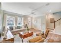 Comfortable living room featuring large windows, plush seating, and a decorative wooden coffee table at 5666 Stafford Rd # 9, Charlotte, NC 28054