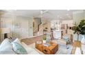 Spacious open floor plan with a cozy living area, a modern kitchen, and beautiful staircase at 5666 Stafford Rd # 9, Charlotte, NC 28054