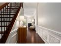 Welcoming entryway with hardwood floors, a staircase, and a view into the living room at 5951 Carrollton Ln, Charlotte, NC 28210