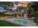 The backyard features a pool, patio area for entertaining, and a privacy fence at 8007 Maxwelton Dr, Huntersville, NC 28078