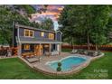 Aerial view of backyard featuring a pool, patio area for entertaining, and a privacy fence at 8007 Maxwelton Dr, Huntersville, NC 28078
