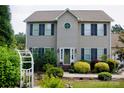 Traditional two-story home with a manicured lawn and established landscaping at 1110 Archer Farm Dr, Salisbury, NC 28144