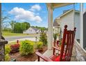 Charming front porch with rocking chairs and well-maintained landscaping at 1318 Encore Ln, Waxhaw, NC 28173