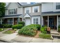 Inviting townhouse exterior with well-manicured landscaping and a welcoming entryway at 15042 Deshler Ct, Charlotte, NC 28273