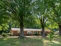 Brick ranch home with a large lawn and mature trees in a quiet neighborhood at 160 Eagle Dr, Salisbury, NC 28144