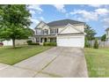 Charming two-story home featuring a well-manicured lawn, a two-car garage, and a classic facade at 170 Glenn Allen Rd, Mooresville, NC 28115